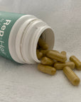 Tints of Nature Rep-hair hair and nail supplements pouring out of a bottle.