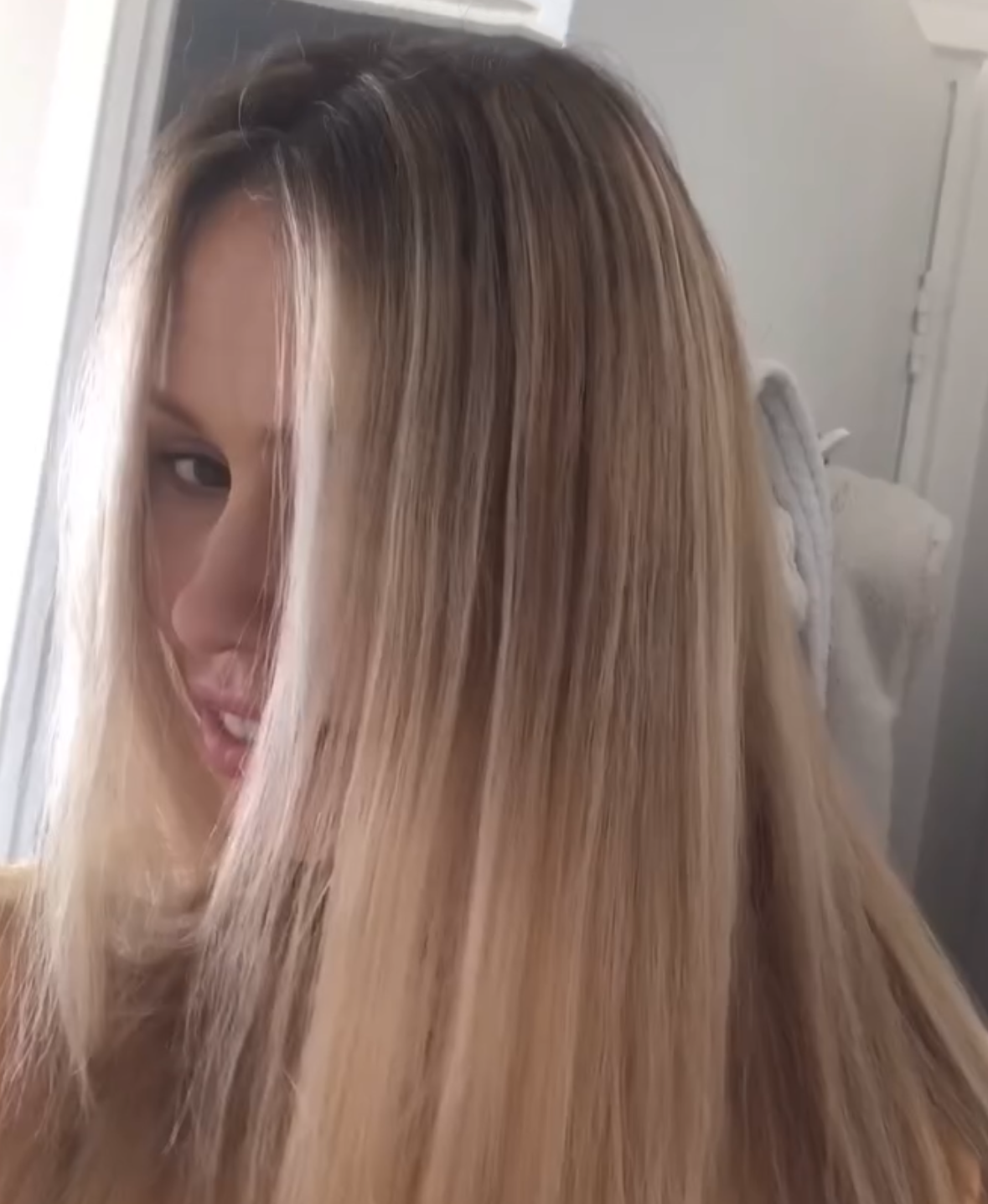 Woman showing results after using Tints of Nature 3-in-1 Ammonia free hair lightener kit